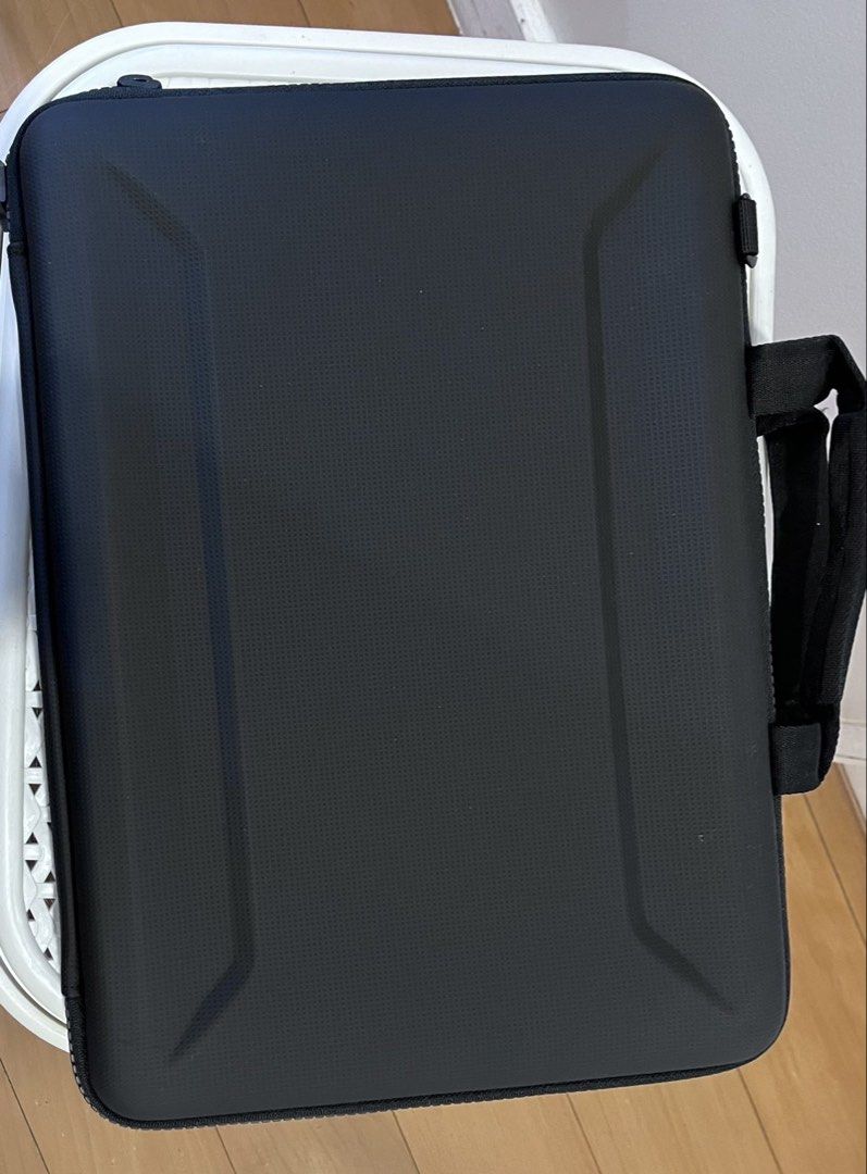 THULE Gauntlet Attaché Laptop Sleeve Case (Category: Laptop Bags & Sleeves) located in Manila. Submitted by this_is_my_closet (Listing ID 1450183225, Image 2). Description: - Black Thule laptop sleeve - Fits devices up to 14 inches - Durable hard shell exterior for maximum protection - Internal straps to keep your laptop securely in place - Built-in handle for easy portability - Ideal for travel and daily commutes - Ensures your tech stays safe a