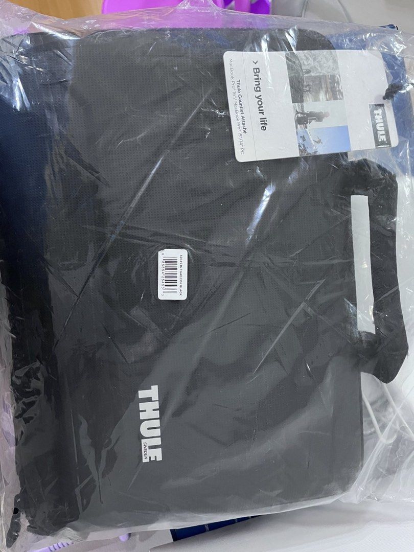 THULE Gauntlet Attaché Laptop Sleeve Case (Category: Laptop Bags & Sleeves) located in Manila. Submitted by this_is_my_closet (Listing ID 1450183225, Image 3). Description: - Black Thule laptop sleeve - Fits devices up to 14 inches - Durable hard shell exterior for maximum protection - Internal straps to keep your laptop securely in place - Built-in handle for easy portability - Ideal for travel and daily commutes - Ensures your tech stays safe a