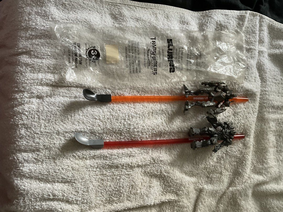 Transformers Slurpee Straws with Figures - 2 Pieces (Category: Action & Battle Toys) located in Las Pinas. Submitted by ydnam0815 (Listing ID 1450135573, Image 1). Description: - Set of 2 collectible Transformers Slurpee straws. - Features two different Transformer figures. - One straw is orange, the other is red. - Ideal for Transformers fans and collectors. - Great addition to any collection..