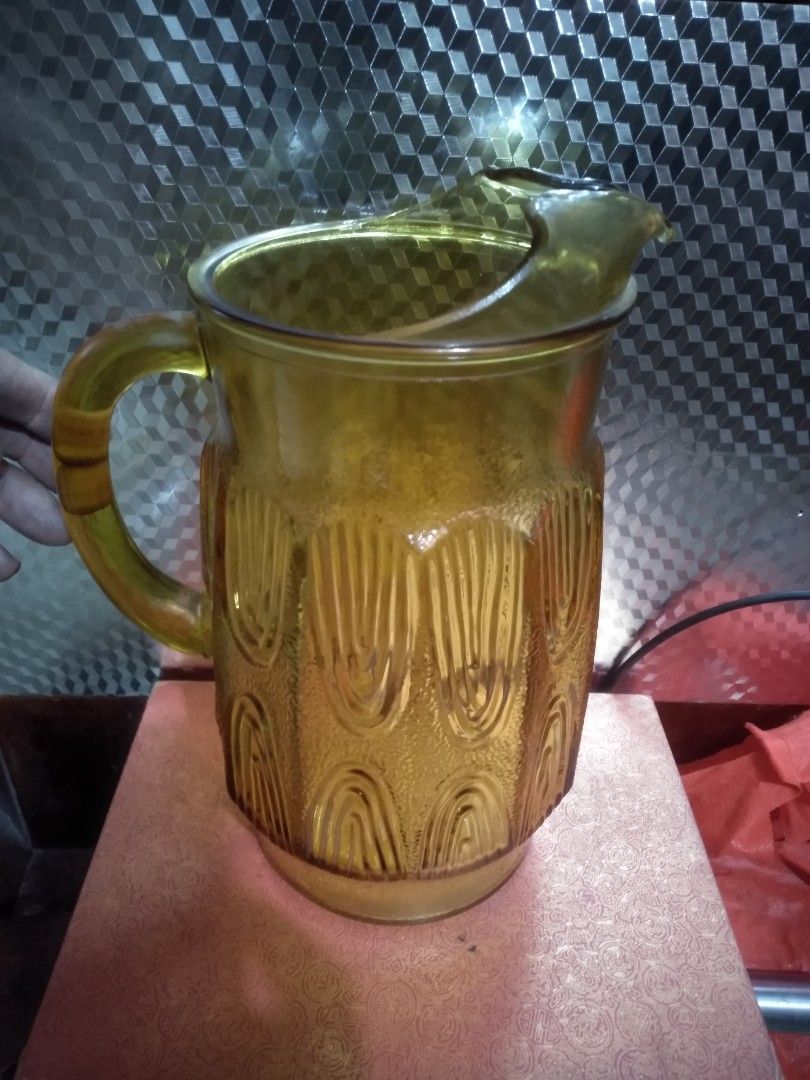Vintage Anchor Hocking Amber Glass pitcher (Category: Pitchers & Dispensers) located in Cabuyao City. Submitted by marymoore (Listing ID 1450315063, Image 1). Description: 1970's Vintage/retro honey amber anchor Hocking pitcher 72oz thumbprint beverage ice lip pitcher ko.