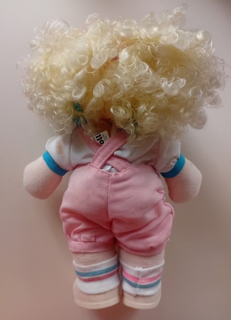Vintage Jollibee Hetty Doll 1994 (Category: Plushies & Soft Toys) located in Navotas City. Submitted by ms.soulana (Listing ID 1450295876, Image 3). Description: -PreOwned LikeNew Vintage Jollibee Hetty Doll from 1994 - Features a vinyl head and soft plush body - Adorable curly blonde hair adorned with red bows - Pink overalls with 'HETTY' embroidered on the front - Approximately 13 inches tall - Perfect for collectors and Jollibee fans! Great Co