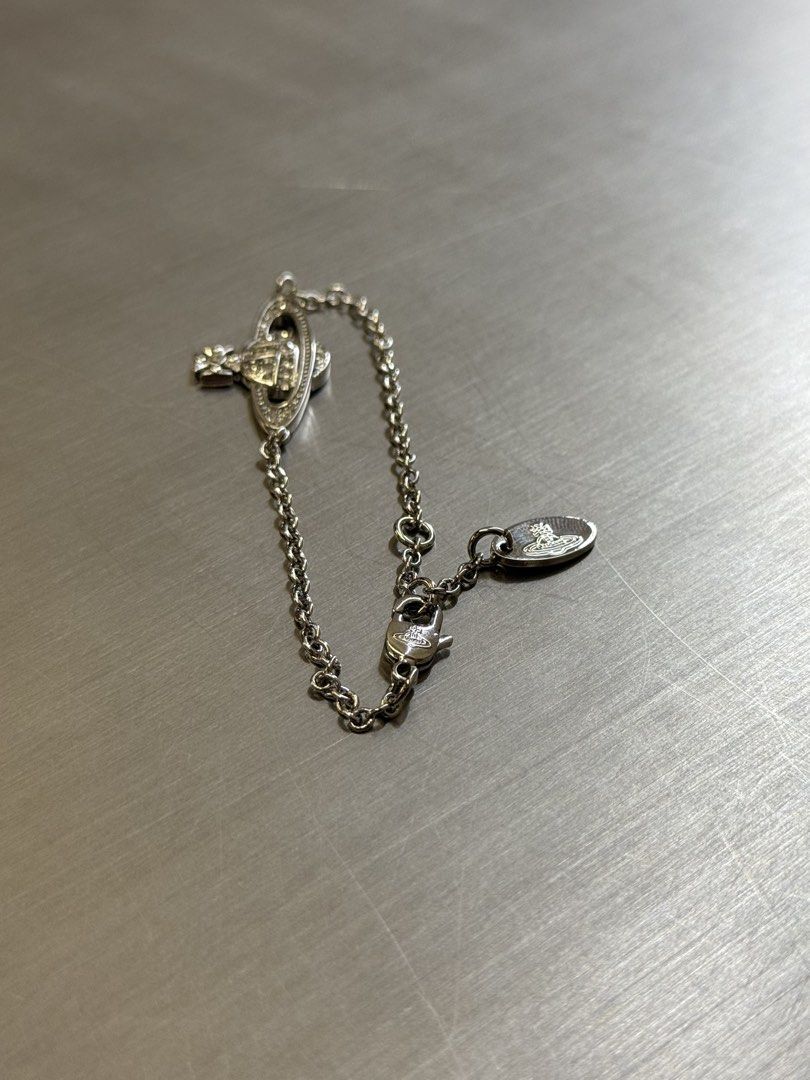VIVIENNE WESTWOOD BRACELET (Category: Luxury Accessories) located in Angeles City. Submitted by secondluxph (Listing ID 1450287692, Image 1). Description: VIVIENNE WESTWOOD MINI BAS RELIEF CHAIN BRACELET CRYSTAL-SET ORB PENDANT LOBSTER CLASP FASTENING PRISTINE CONDITION JAPAN/HONGKONG SOURCE.