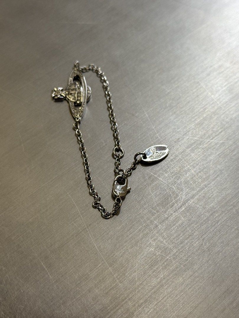 VIVIENNE WESTWOOD BRACELET (Category: Luxury Accessories) located in Angeles City. Submitted by secondluxph (Listing ID 1450287692, Image 3). Description: VIVIENNE WESTWOOD MINI BAS RELIEF CHAIN BRACELET CRYSTAL-SET ORB PENDANT LOBSTER CLASP FASTENING PRISTINE CONDITION JAPAN/HONGKONG SOURCE.