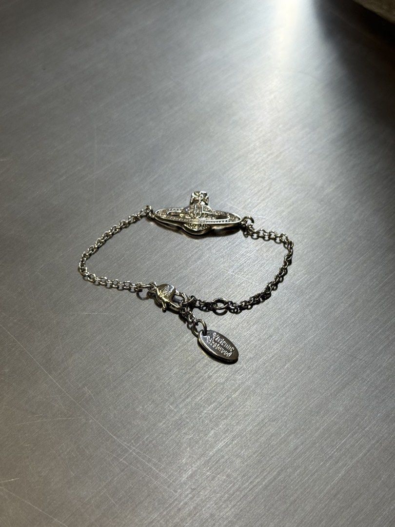 VIVIENNE WESTWOOD BRACELET (Category: Luxury Accessories) located in Angeles City. Submitted by secondluxph (Listing ID 1450287692, Image 2). Description: VIVIENNE WESTWOOD MINI BAS RELIEF CHAIN BRACELET CRYSTAL-SET ORB PENDANT LOBSTER CLASP FASTENING PRISTINE CONDITION JAPAN/HONGKONG SOURCE.