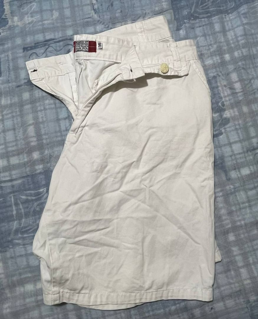 White Chino Shorts (Category: Shorts) located in Las Pinas. Submitted by refo1d.studio (Listing ID 1450286913, Image 3). Description: - Classic white chino shorts - Button and zip front closure - Two back pockets - Comfortable for everyday wear - Versatile wardrobe staple.