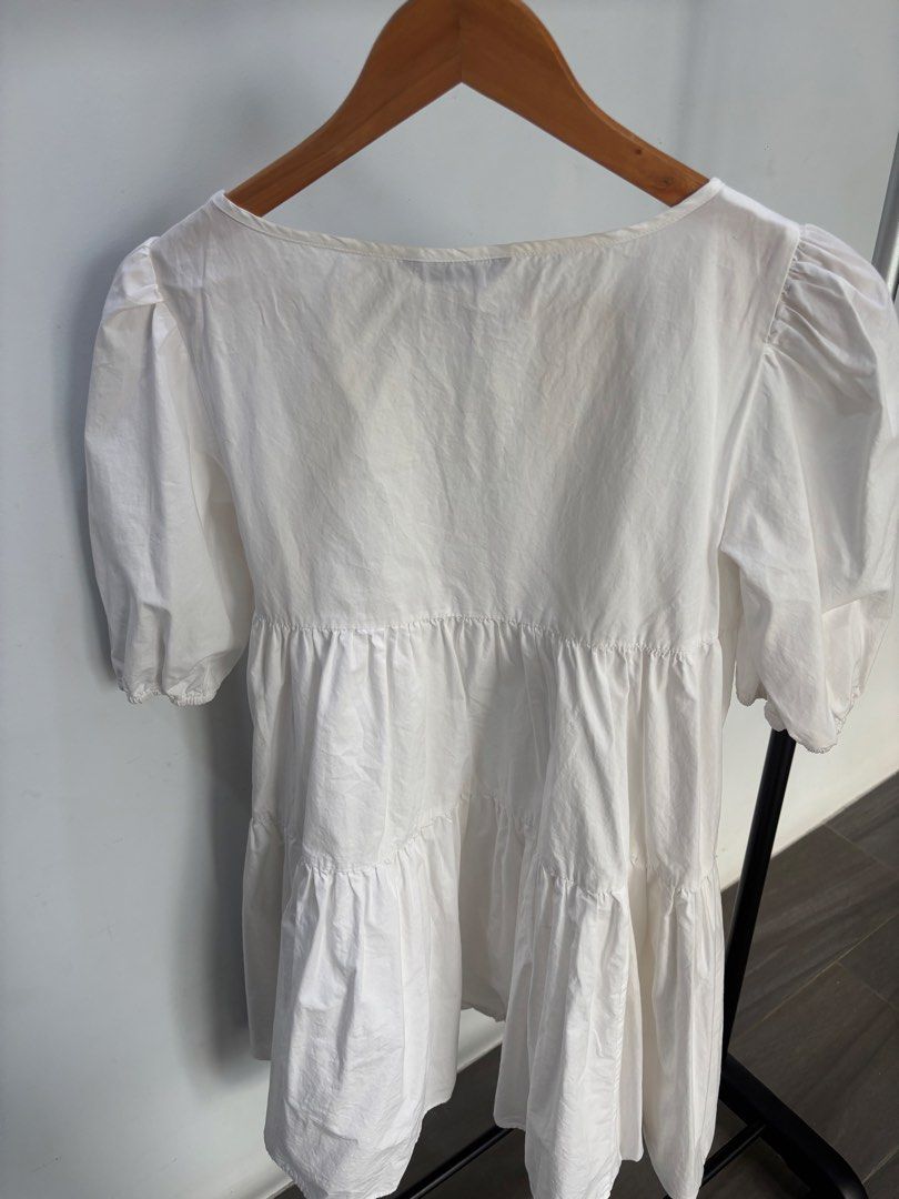 White Puff Sleeve Dress (Category: Blouses) located in Mandaue City. Submitted by offthehanger26 (Listing ID 1450184462, Image 2). Description: - Can fit small frames as well - With minor discoloration on neckline, barely noticeable when worn - Comfy and flowy design - Can be dressed up or down!.