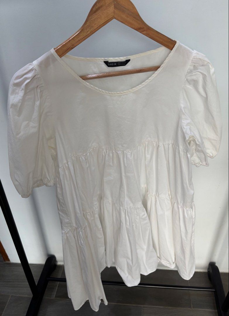 White Puff Sleeve Dress (Category: Blouses) located in Mandaue City. Submitted by offthehanger26 (Listing ID 1450184462, Image 1). Description: - Can fit small frames as well - With minor discoloration on neckline, barely noticeable when worn - Comfy and flowy design - Can be dressed up or down!.