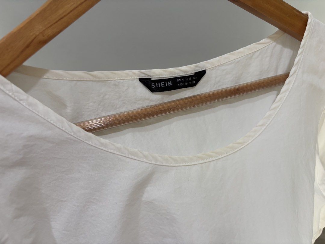 White Puff Sleeve Dress (Category: Blouses) located in Mandaue City. Submitted by offthehanger26 (Listing ID 1450184462, Image 3). Description: - Can fit small frames as well - With minor discoloration on neckline, barely noticeable when worn - Comfy and flowy design - Can be dressed up or down!.
