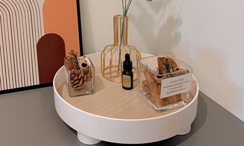 White Rotating Storage Tray with Wood Grain Insert (Category: Storage Boxes & Baskets) located in Taguig. Submitted by ceej0915 (Listing ID 1450284861, Image 1). Description: - White rotating tray with a stylish wood grain insert. - Dimensions: 23cm diameter, 7.3cm height. - Ideal for organizing countertops, vanities, and desks. - Versatile storage for perfumes, skincare, decor, or spices. - Smooth 360° rotation for easy access to your items. - A