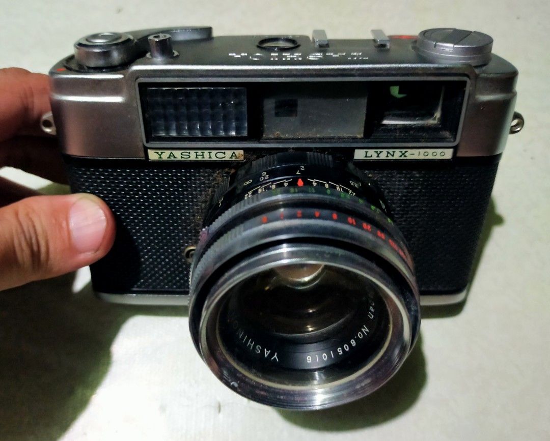 YASHICA Lynx-1000 RangeFinder (Category: Cameras) located in Manila. Submitted by elilee_80 (Listing ID 1450268166, Image 1). Description: - Yashica Lynx-1000 film camera - Yashinon-DS-M 45mm f/1.7 lens (looks clean) - Original leather case and strap included - Minor scuffs on body from normal use - Classic point-and-shoot, great for film photography enthusiasts FOR SALE! Vintage 1960 YASHICA Lynx-1000 (Range Finder 35mm Film Camera) RARE With LE