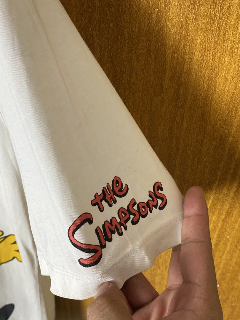 Zara x The Simpsons (Category: Tshirts & Polo Shirts ) located in Meycauayan. Submitted by arkibo (Listing ID 1450308025, Image 2). Description: - White Zara T-shirt - Graphic of Homer Simpson running - 'The Simpsons' logo on sleeve - Size: Large (L) - Made in Morocco - Perfect for Simpsons fans! 8/10 (Needs Washing).