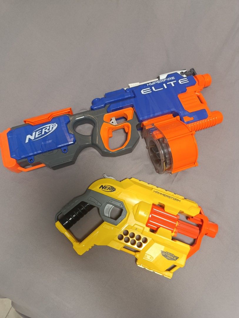 2 Nerf Elite Hyperfire and Hammerstorm Blasters (Category: Action & Battle Toys) located in Makati City. Submitted by urplugph (Listing ID 1450349210, Image 1). Description: - Nerf Elite Hyperfire (blue and orange) with drum magazine included. - Yellow Hammerstorm blaster also included. - Perfect for any Nerf enthusiast looking for a great deal..