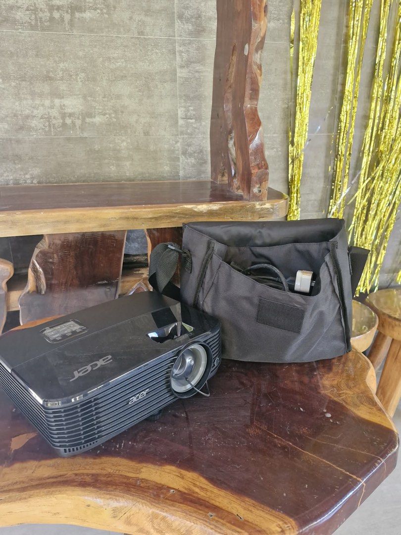 Acer Projector with Bag and HDMI (Category: Projectors) located in Lipa City. Submitted by sunchaser99 (Listing ID 1450417942, Image 2). Description: - Acer projector for sale - Includes original carrying bag - All necessary cables included - Ideal for presentations and movie nights - Tested and confirmed working - Ready for immediate use.
