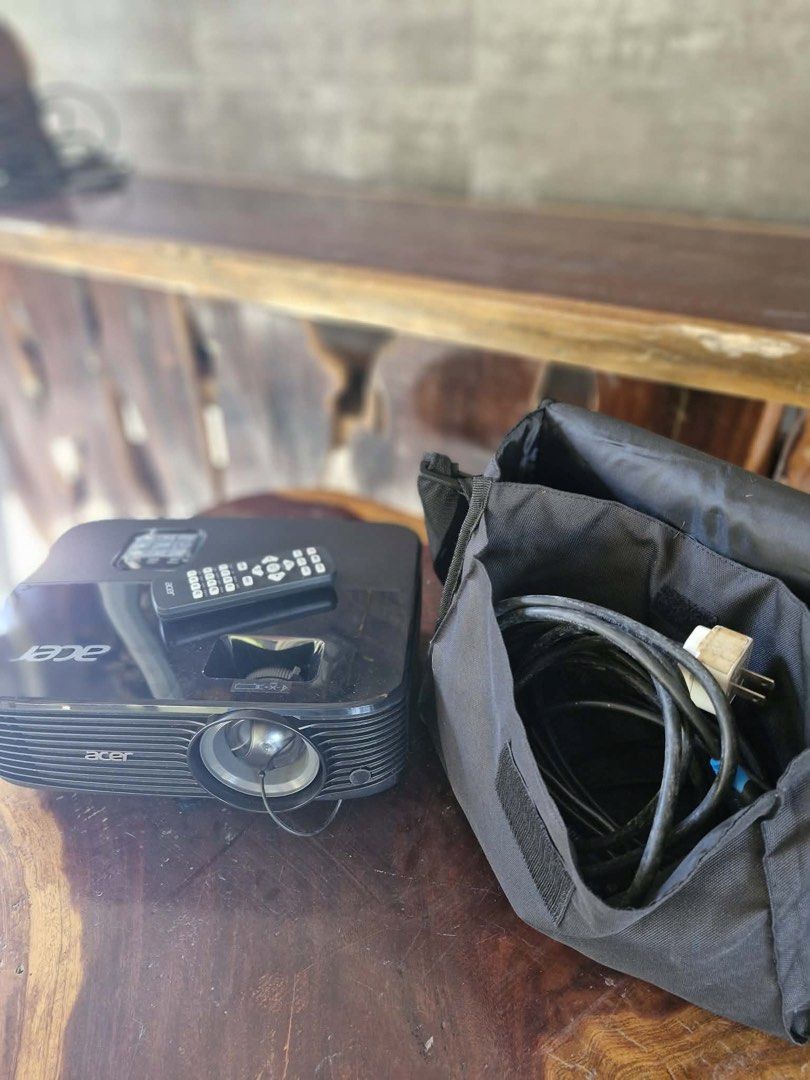 Acer Projector with Bag and HDMI (Category: Projectors) located in Lipa City. Submitted by sunchaser99 (Listing ID 1450417942, Image 1). Description: - Acer projector for sale - Includes original carrying bag - All necessary cables included - Ideal for presentations and movie nights - Tested and confirmed working - Ready for immediate use.