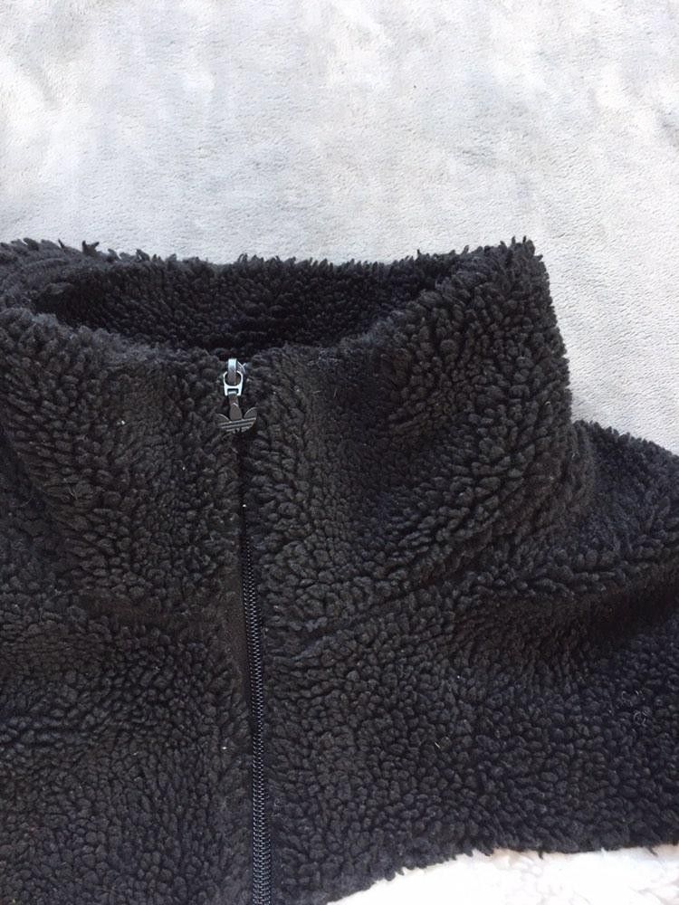 Adidas Big Logo Sherpa Jacket Medium Black White (Category: Coats, Jackets and Outerwear) located in Manila. Submitted by niggzreyno51476 (Listing ID 1450427319, Image 3). Description: - Adidas Big Logo Sherpa Jacket - Size: Medium - Color: Black and White - Material: Made with recycled polyester - Features: High stand collar for warmth and wind protection - Design: Big Trefoil logo on front and back - Pockets: Zipper pockets for secure storage -