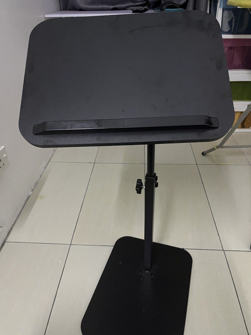 Adjustable Black Laptop Stand with Base (Category: Other Accessories) located in Selayang. Submitted by fierceearth-16555c (Listing ID 1450323569, Image 3). Description: - Adjustable black laptop stand - Customize height and angle with easy-to-use knobs - Features a lip to keep your laptop secure - Stable, flat base for reliable support - Ideal for comfortable working from home or studying.