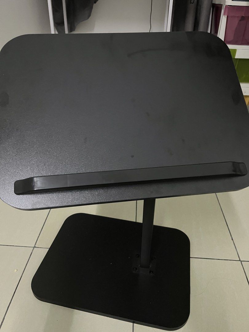 Adjustable Black Laptop Stand with Base (Category: Other Accessories) located in Selayang. Submitted by fierceearth-16555c (Listing ID 1450323569, Image 1). Description: - Adjustable black laptop stand - Customize height and angle with easy-to-use knobs - Features a lip to keep your laptop secure - Stable, flat base for reliable support - Ideal for comfortable working from home or studying.