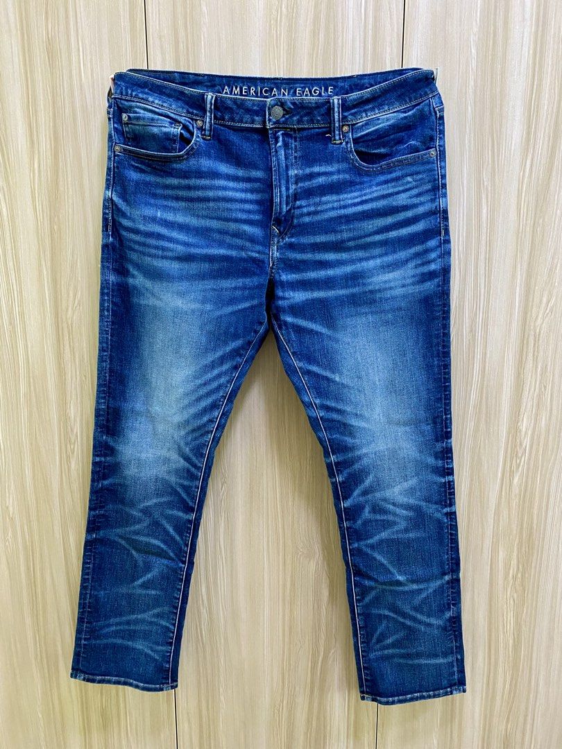American Eagle Men's Blue Wash Jeans (Category: Jeans) located in Cebu City. Submitted by jhuyjoy (Listing ID 1450341735, Image 2). Description: American Eagle Men Slim Straight Jeans Size: US 38 x 32 (Can fit a 36"-waistline; length: 41") Color: Dark Blue Wash How it Fits Slim Straight cut Sits below your waist Composition and Details - 73% Cotton, 25% Recycled Cotton, 2% Elastane - Zip fly - 5-pocket styling - AirFlex: Authentic denim look with