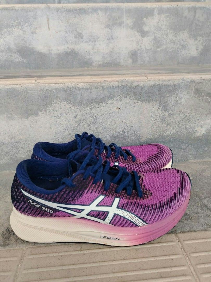 ASICS Magic Speed Running Shoes Pink Purple (Category: Sneakers) located in Kuala Terengganu. Submitted by afiqali188 (Listing ID 1450448176, Image 1). Description: - ASICS Magic Speed running shoes - Size: [UK 5/ US 7.5] - Colour: Pink and purple knit upper with white ASICS stripes - Laces & Interior: Blue - Ideal for: Running.