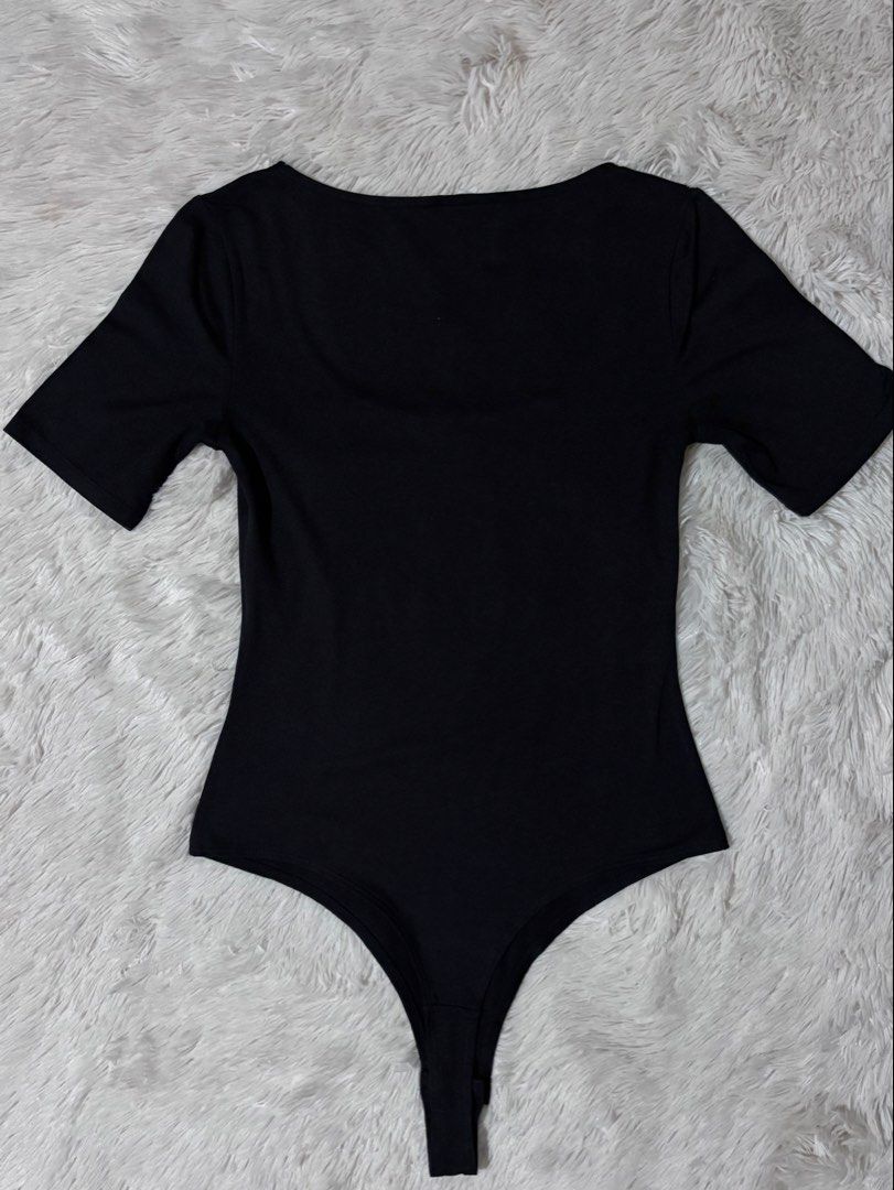 Authentic H&M Fitted Wide Low Neck Bodysuit (Category: Shirts) located in Bulacan. Submitted by rin2024 (Listing ID 1450412680, Image 2). Description: Authentic H&M Fitted Wide Low Neck Bodysuit - With low and wide neck - With stretchable fabric - With secure buttons - With double fabric on chest area Payment Method: GCash only. Delivery Options: Lalamove, Grab, or J&T only, with shipping fee shouldered by buyer..