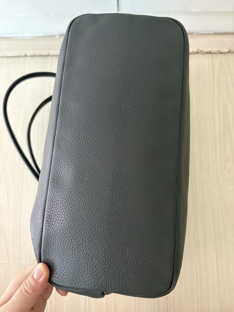 Authentic longchamp leather shoulder bag gray small (Category: Luxury Bags & Wallets) located in Makati City. Submitted by ssofiasellss (Listing ID 1450346936, Image 3). Description: Minimal signs of use Real leather Color: gray Guaranteed original from Paris Selling for a quarter of purchase price Rfs: decluttering Comes with longchamp paper bag.
