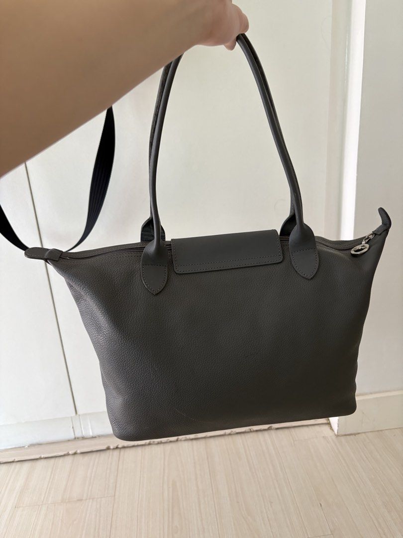 Authentic longchamp leather shoulder bag gray small (Category: Luxury Bags & Wallets) located in Makati City. Submitted by ssofiasellss (Listing ID 1450346936, Image 2). Description: Minimal signs of use Real leather Color: gray Guaranteed original from Paris Selling for a quarter of purchase price Rfs: decluttering Comes with longchamp paper bag.