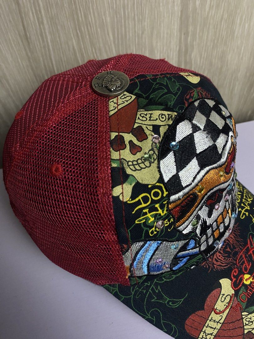 AUTHENTIC Y2K ED HARDY SKULL RACER TRUCKER CAP (Category: Caps & Hats) located in Marikina City. Submitted by ilayastreetarchives_ (Listing ID 1450524357, Image 3). Description: AUTHENTIC Y2K ED HARDY SKULL RACER TRUCKER CAP OSFA (ONE SIZE FITS ALL) All details / gems are still intact (no missing piece) Condition: Excellent Issues: None Color Rate: 9.5/10 (colors are still vibrant) — 2,249 php 🔌 Marikina City, Ph.
