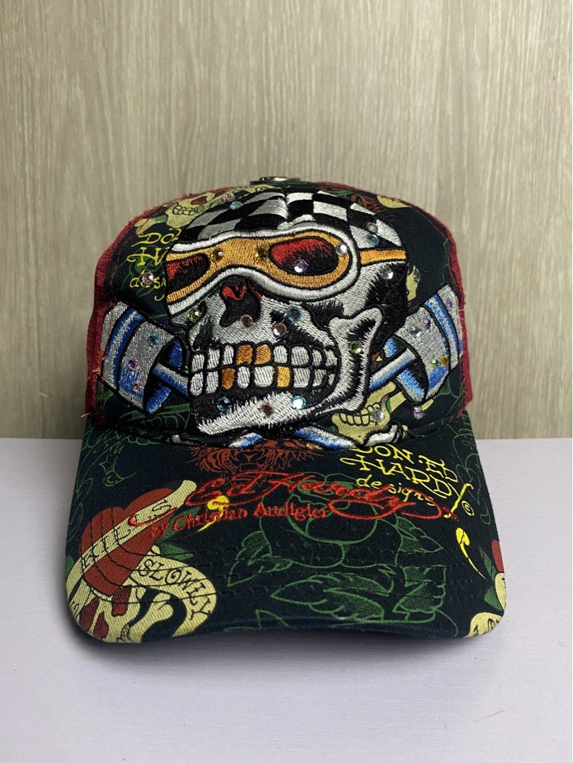 AUTHENTIC Y2K ED HARDY SKULL RACER TRUCKER CAP (Category: Caps & Hats) located in Marikina City. Submitted by ilayastreetarchives_ (Listing ID 1450524357, Image 1). Description: AUTHENTIC Y2K ED HARDY SKULL RACER TRUCKER CAP OSFA (ONE SIZE FITS ALL) All details / gems are still intact (no missing piece) Condition: Excellent Issues: None Color Rate: 9.5/10 (colors are still vibrant) — 2,249 php 🔌 Marikina City, Ph.