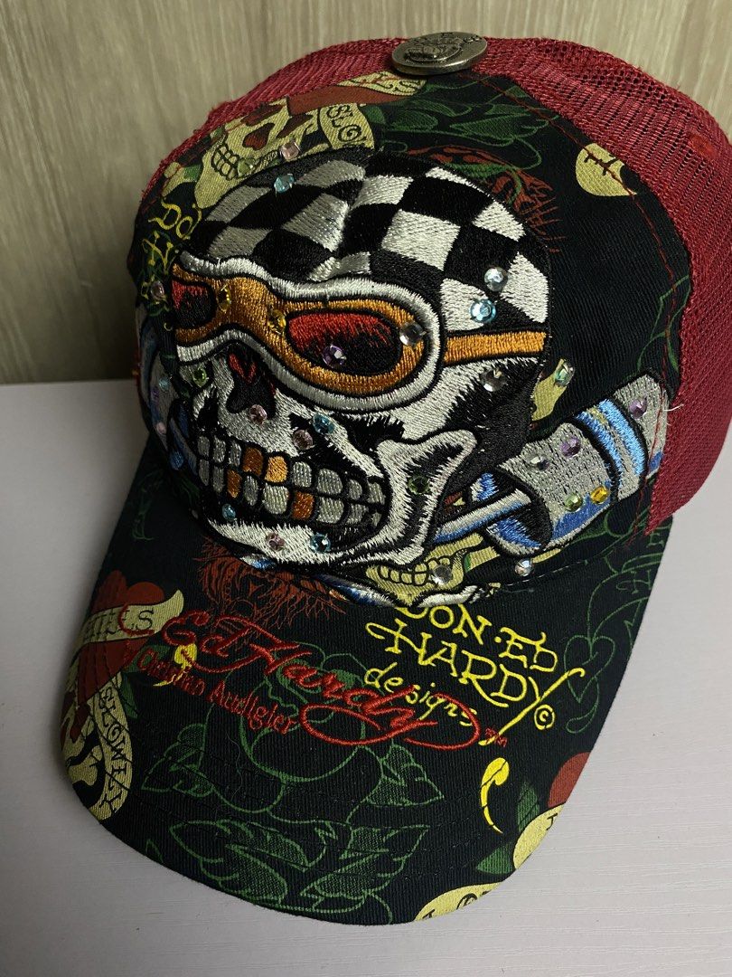 AUTHENTIC Y2K ED HARDY SKULL RACER TRUCKER CAP (Category: Caps & Hats) located in Marikina City. Submitted by ilayastreetarchives_ (Listing ID 1450524357, Image 2). Description: AUTHENTIC Y2K ED HARDY SKULL RACER TRUCKER CAP OSFA (ONE SIZE FITS ALL) All details / gems are still intact (no missing piece) Condition: Excellent Issues: None Color Rate: 9.5/10 (colors are still vibrant) — 2,249 php 🔌 Marikina City, Ph.