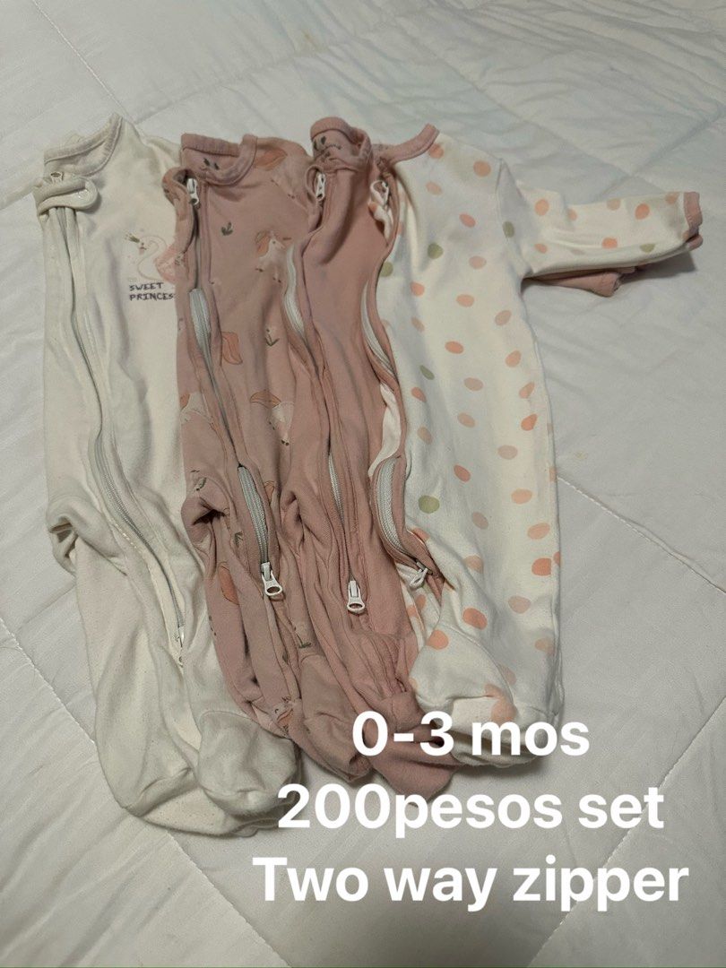 Baby Sleepsuits & Outfits Bundle (0-9 Months) (Category: Babies & Kids Fashion) located in Iloilo. Submitted by sheariah23 (Listing ID 1450436824, Image 1). Description: - Bundle of baby clothes for sale. - Includes sleepsuits suitable for 0-3 months with convenient two-way zippers. - Also includes outfits for 6-9 months. - Many items are rarely used. - One set of pants is brand new, never been used. - Made from soft cotton for baby's comfort. - 