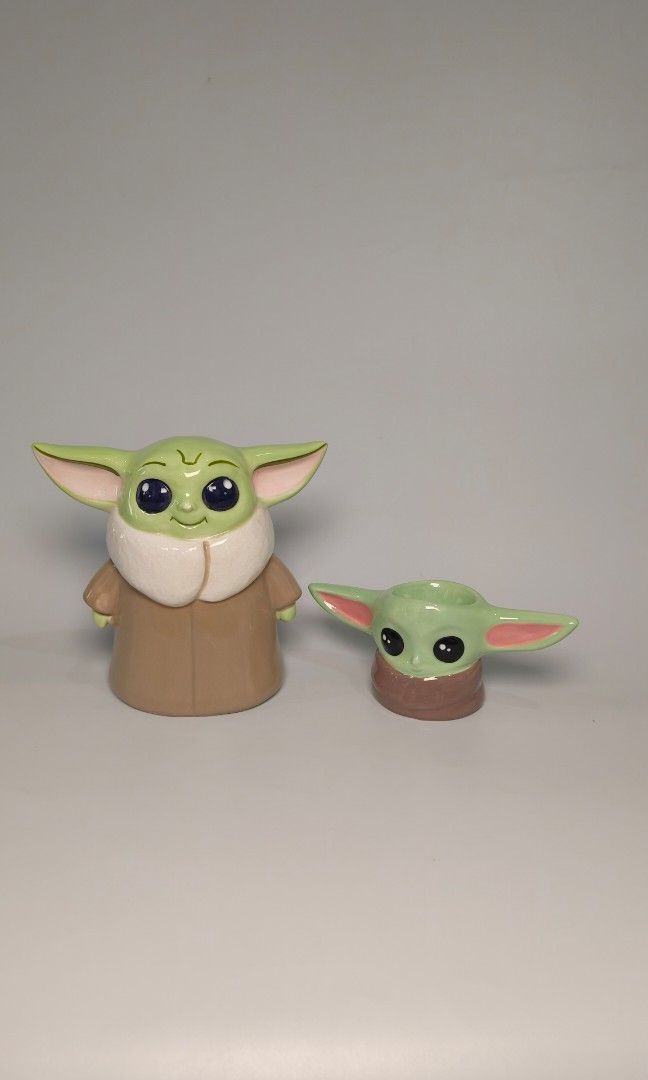 Baby Yoda Starwars set (Category: Figurines & Statues) located in Cavite. Submitted by phtmt (Listing ID 1450448866, Image 2). Description: Coinbank (see photos for condition) H 6 inches L ear to ear 6.5 inches W 10 inches Small yoda H 2.7 inches L ear to ear 6.4 inches W 2.6 inches.