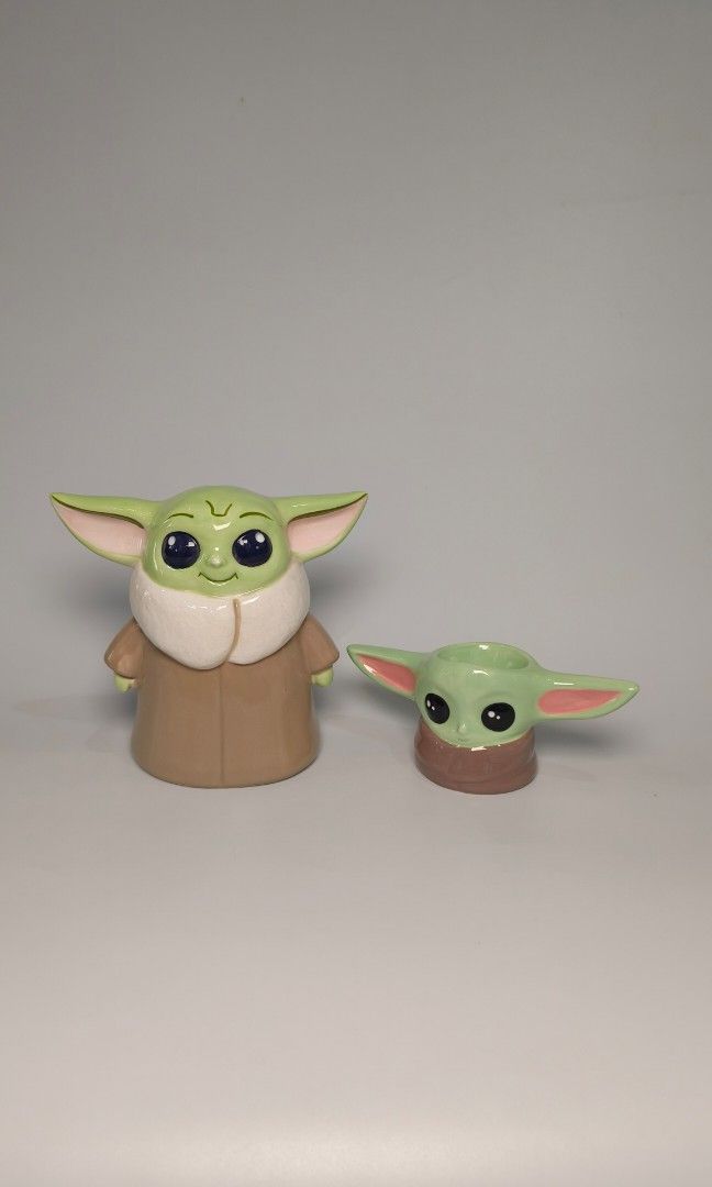 Baby Yoda Starwars set (Category: Figurines & Statues) located in Cavite. Submitted by phtmt (Listing ID 1450448866, Image 1). Description: Coinbank (see photos for condition) H 6 inches L ear to ear 6.5 inches W 10 inches Small yoda H 2.7 inches L ear to ear 6.4 inches W 2.6 inches.