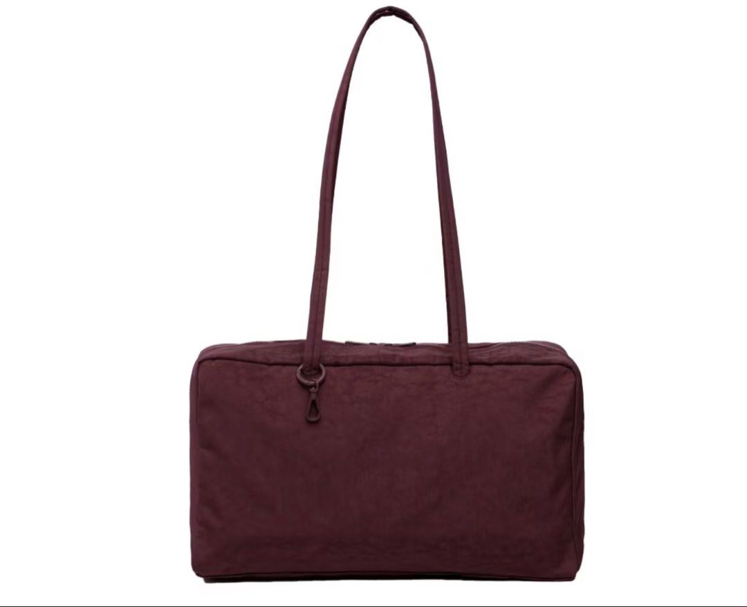 Baggu Medium Nylon Bowler Bag (Mahogany) (Category: Tote Bags) located in Mandaluyong City. Submitted by txd13_ (Listing ID 1450421918, Image 1). Description: SUPER love this but honestly i have too much things in my bag and it cant fit anymore and i wanna buy a new one HAHA - can fit 13” macbook air - 1 pocket inside - with key clip inside - slightly used, NO flaws!! (took good care of em) - original price is 5195 (certified calm).