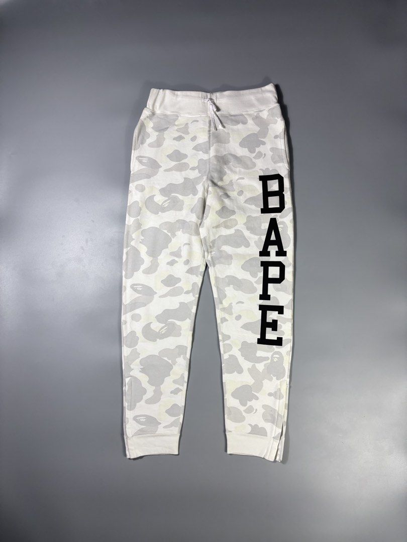 Bape Side Script “Glow in The Dark” Gray Camou SweatPants (Category: Joggers) located in Manila. Submitted by whowearsstreetwear (Listing ID 1450498786, Image 1). Description: Bape Side Script “Glow in The Dark” Gray Camou SweatPants (Authentic) - Size: Small on tag (measurements in inches) W - 28 - 34 L - 40 Condition: Very Good Flaw/s: stains (check pics) + shipping fee Location: Manila (Near UST) .