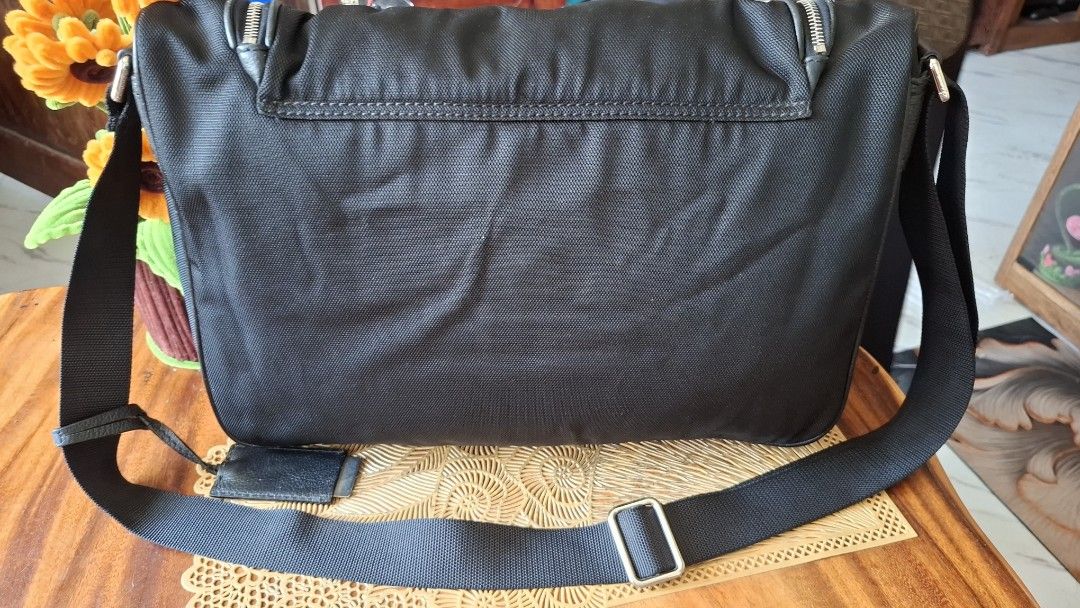 CALVIN KLEIN Black Messenger Bag with Adjustable Strap (Category: Luxury Bags & Wallets) located in Libon. Submitted by jaladzarmi80045 (Listing ID 1450347801, Image 2). Description: - Durable textured black messenger bag - Main zippered compartment - Adjustable shoulder strap - Small leather tag accent - Spacious interior - Ideal for everyday use or travel.
