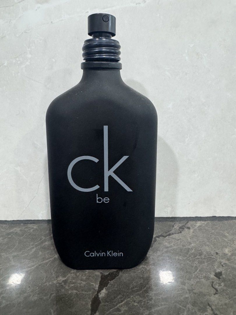 Calvin Klein CK Be Eau de Toilette Spray 100ml (Category: Fragrance & Deodorants) located in Manila. Submitted by crazycat13 (Listing ID 1450354073, Image 2). Description: Hlaf bottle - Authentic Calvin Klein CK Be Eau de Toilette - Sleek black matte bottle with white CK be logo - Classic, versatile scent perfect for everyday wear.
