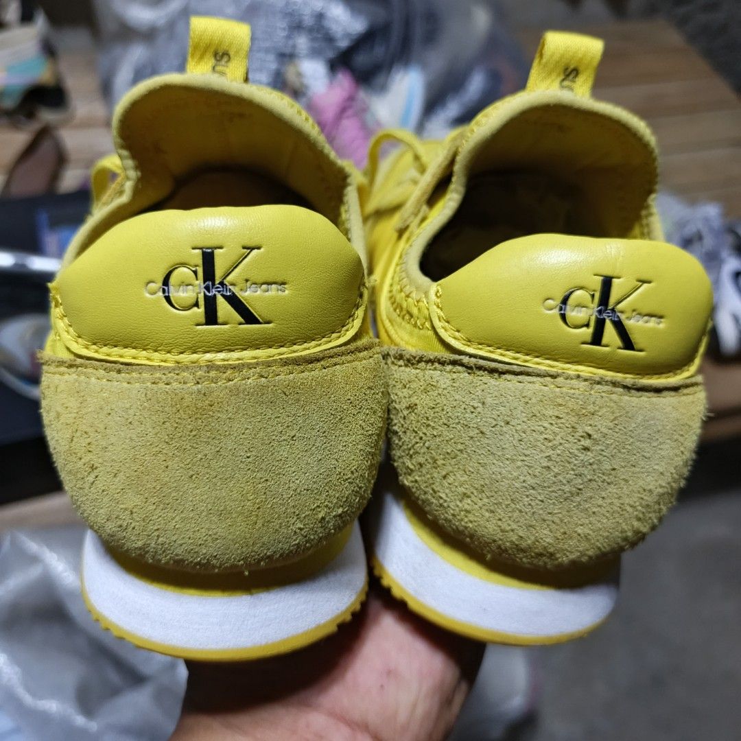 Calvin Klein Jeans Yellow Sneakers (Category: Sneakers) located in Lala. Submitted by ryban91 (Listing ID 1450491470, Image 3). Description: - Yellow Calvin Klein Jeans sneakers - Features classic CK logo on side and heel - Matching yellow laces - Soles branded with Calvin Klein Jeans - Ideal for everyday casual wear.