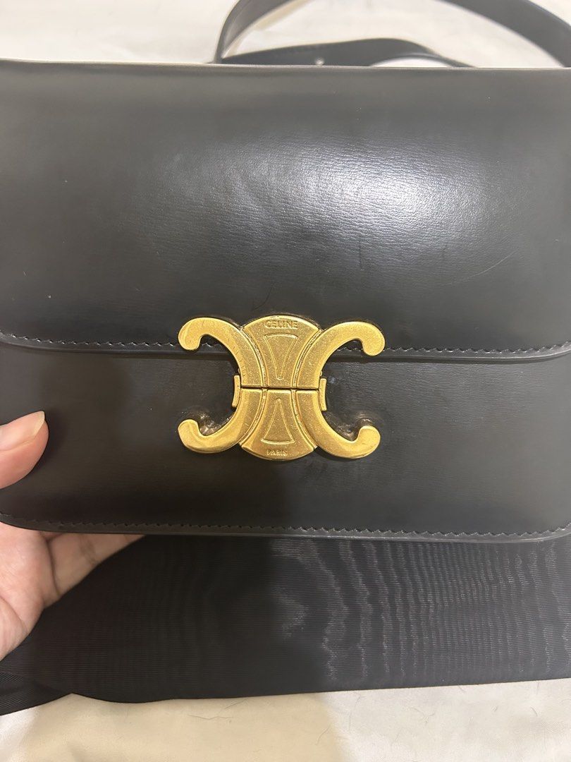 [RUSH] Celine Black Leather Triomphe Shoulder Bag (Category: Luxury Bags & Wallets) located in Bulacan. Submitted by kokokrunchynft (Listing ID 1450321619, Image 2). Description: - NGA Black Leather Celine Shoulder Bag - Iconic Gold-Tone Triomphe Clasp - Comes with Dust Bag - Interior is Clean - Adjustable Strap for Versatile Wear - A Classic and Timeless Piece.