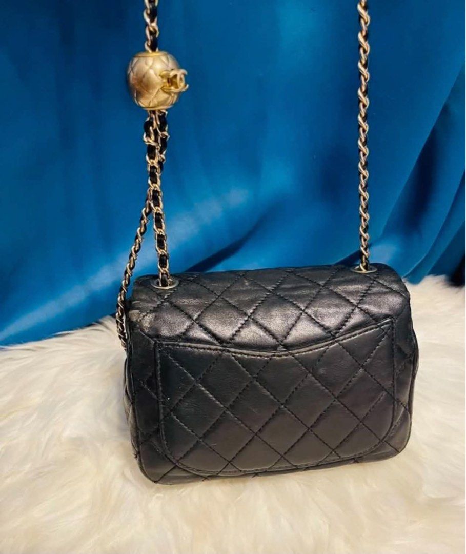 Chanel Black Quilted Leather Chain Shoulder Bag (Category: Luxury Bags & Wallets) located in Las Pinas. Submitted by japanthriftstore (Listing ID 1450446614, Image 2). Description: SUPER SALE🎌🎌🎌 - Classic Chanel black quilted leather shoulder bag - Gold chain strap with unique ball charm detail - Iconic CC logo clasp - Timeless statement piece Nasa picture yung maliit na flaws… at may konting color pink sa loob kayo na maglaba. As is where is 
