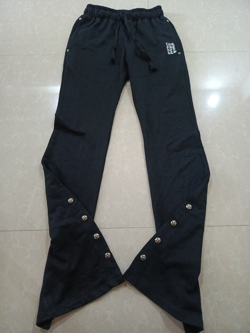 Chrome Hearts Black Flare Pants with Snap Buttons (Category: Other Bottoms) located in Cabatuan. Submitted by penthegreat (Listing ID 1450460995, Image 3). Description: No waisttag(off/legit) (11 Hem) (40.5 length)(11.5width) stretchable good for size 23-26 9/10 condition, minimal issue only pinholes - Black flare pants - Drawstring waist for adjustable fit - Snap buttons along the leg for styling options - Iconic Chrome Hearts logo on the front 