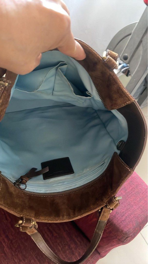Coach Brown Suede Tote hand Bag (Category: Luxury Bags & Wallets) located in Taguig. Submitted by levinc (Listing ID 1437181492, Image 2). Description: - Coach brown suede tote bag - Dual top handles - Exterior side pockets - Leather trim - Includes Coach hangtag - Classic, structured design DM for more pics!.