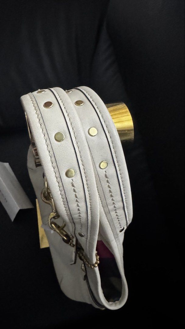 Coach Legacy Belted Ergo (Category: Luxury Bags & Wallets) located in Digos. Submitted by tindahannipre (Listing ID 1450409710, Image 3). Description: - Cream leather Coach hobo bag - Elegant gold hardware details - Vibrant, colorful striped interior lining - Spacious main compartment for all your essentials - Comes with original Coach authenticity card - Ideal everyday bag for style and practicality.