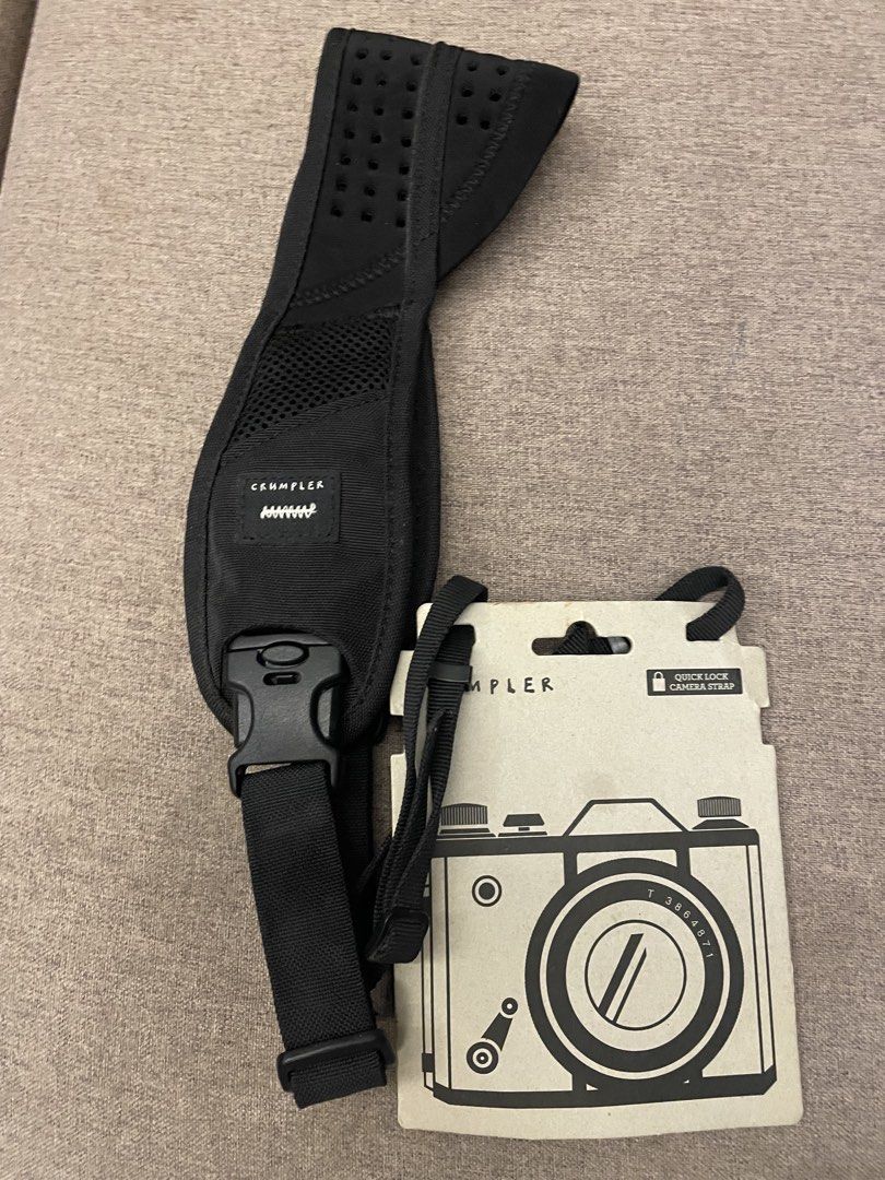 Crumpler Quick Lock Camera Strap (Category: Camera Bags & Carriers) located in Putrajaya. Submitted by one2.onlinestoreonline (Listing ID 1450444011, Image 1). Description: - Crumpler camera strap in black - Features a quick lock system for secure attachment - Adjustable length for personalized comfort - Padded with mesh for enhanced carrying comfort - Comes with original packaging - Ideal for securely carrying your camera.