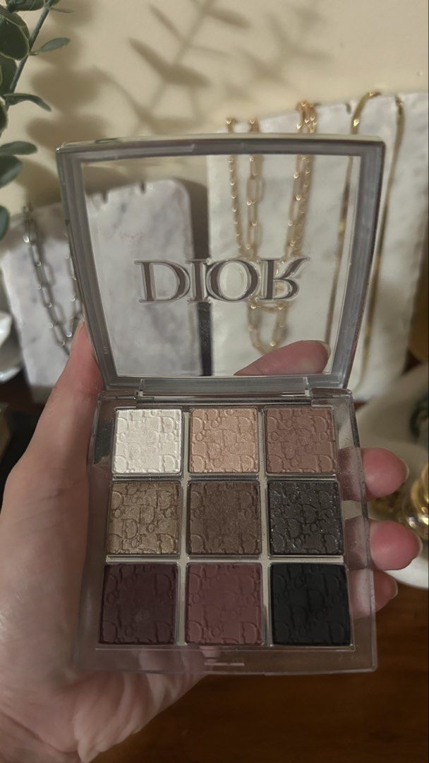 Dior Backstage 9-Color Eyeshadow Palette (Category: Makeup) located in Talisay. Submitted by zee_xx668 (Listing ID 1450493913, Image 3). Description: - Authentic Dior eyeshadow palette - #002 Smoky essentials - Features 9 versatile shades - Includes neutral and deeper tones, perfect for everyday or smoky eye looks - Comes in a clear case with the iconic Dior logo - Some shades have been lightly swatched - Selling because it's not used frequently.