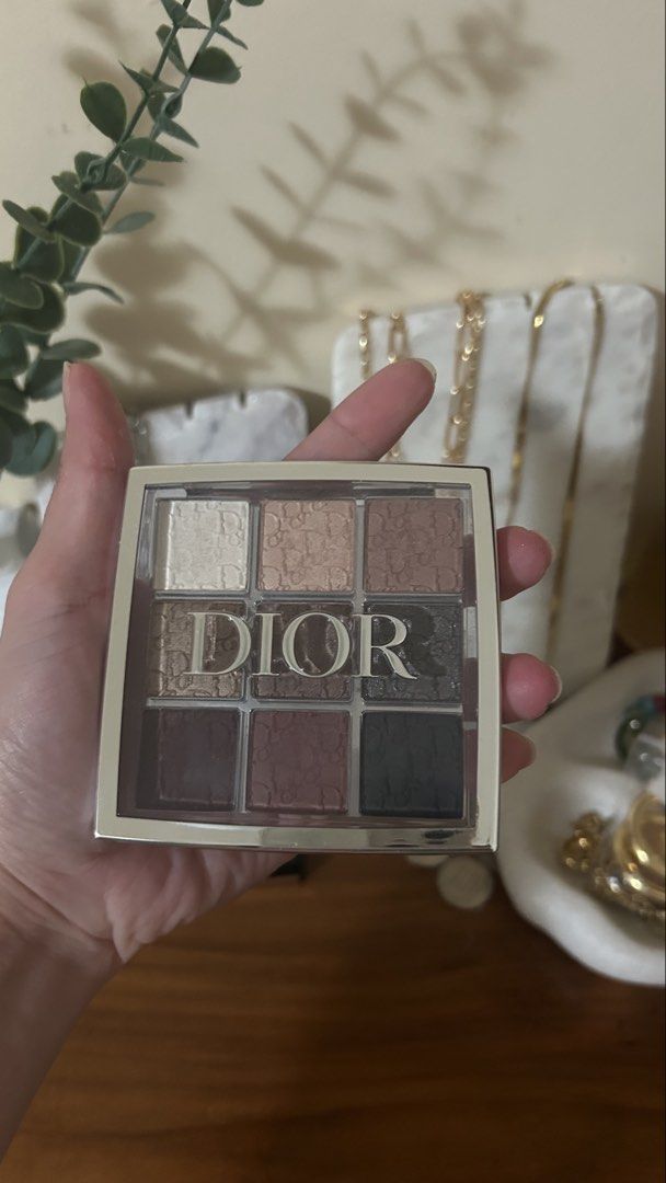 Dior Backstage 9-Color Eyeshadow Palette (Category: Makeup) located in Talisay. Submitted by zee_xx668 (Listing ID 1450493913, Image 1). Description: - Authentic Dior eyeshadow palette - #002 Smoky essentials - Features 9 versatile shades - Includes neutral and deeper tones, perfect for everyday or smoky eye looks - Comes in a clear case with the iconic Dior logo - Some shades have been lightly swatched - Selling because it's not used frequently.