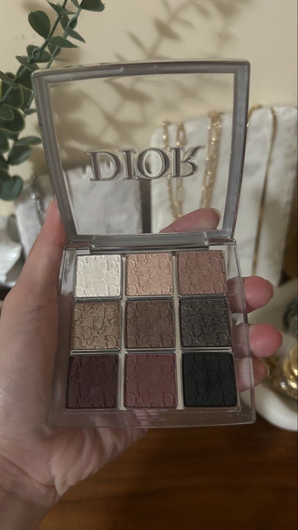 Dior Backstage 9-Color Eyeshadow Palette (Category: Makeup) located in Talisay. Submitted by zee_xx668 (Listing ID 1450493913, Image 2). Description: - Authentic Dior eyeshadow palette - #002 Smoky essentials - Features 9 versatile shades - Includes neutral and deeper tones, perfect for everyday or smoky eye looks - Comes in a clear case with the iconic Dior logo - Some shades have been lightly swatched - Selling because it's not used frequently.