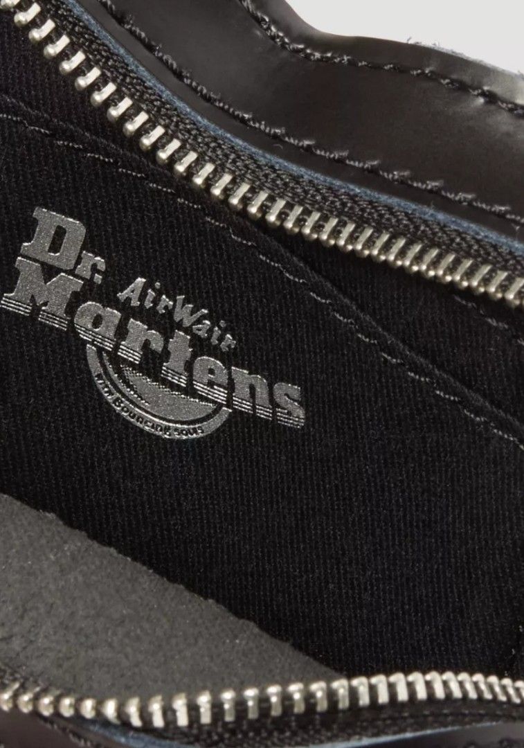 Dr. Martens Heart Shape 6 inches (excellent condition) (Category: Cross-body Bags) located in Quezon City. Submitted by viflor (Listing ID 1450352900, Image 3). Description: Makati city almost new condition - Iconic Dr. Martens heart bag - Color: Black patent and leather - Features a silver chain strap - Zipper closure - Interior shows Dr. Martens Airwair logo - Size: 6 inches - Ideal for carrying essentials.