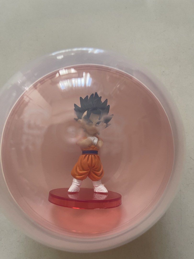 Dragon Ball Z Vegito Chibi Figure (Category: Figurines & Statues) located in Quezon City. Submitted by kingcurator (Listing ID 1450393705, Image 3). Description: - Cute Dragon Ball Z Vegito figure in chibi style. - Stands on a red base. - Approximately 3-4 inches tall. - Comes in a clear plastic ball packaging. - Ideal addition to any Dragon Ball fan's collection..