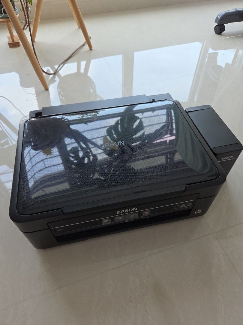 Epson Printer (Category: Printers, Scanners & Copiers) located in Singapore. Submitted by iqwerty (Listing ID 1450375148, Image 1). Description: - Sleek black Epson printer - Ready for a new home - Feel free to ask questions! - working conditions - Printer head clogged need to clean .