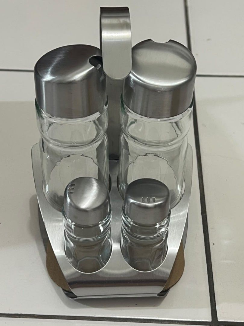 Ernesto 5 Piece Condiment Set - Brushed Stainless Steel Holder (Category: Other Kitchenware & Tableware) located in Penampang. Submitted by yuna80 (Listing ID 1450342009, Image 3). Description: - Ernesto condiment set - Brushed stainless steel holder - 4 glass containers included - Features shakers and larger bottles for oil/vinegar - Ideal for kitchen counter or dining table - Keeps your seasonings easily accessible.